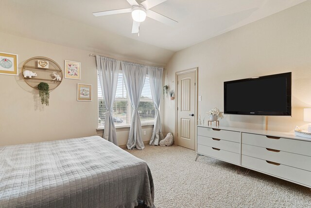 bedroom featuring light carpet, lofted ceiling, and ceiling fan