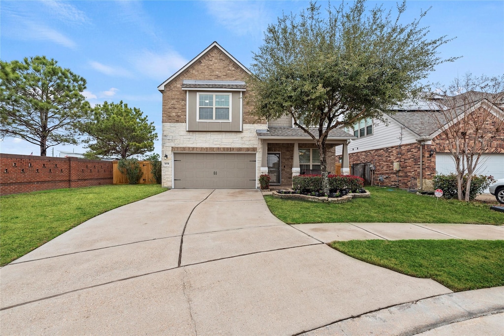 view of front of house with a garage and a front yard