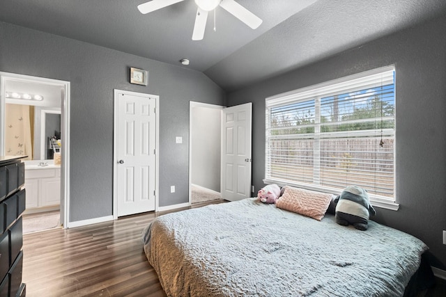 518 Lovers Ln, Dayton, TX 77535 - bedroom featuring ensuite bathroom, lofted ceiling, a textured ceiling, dark hardwood / wood-style floors, and ceiling fan