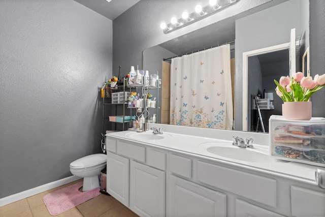 518 Lovers Ln, Dayton, TX 77535 - bathroom featuring walk in shower, vanity, toilet, and tile patterned flooring