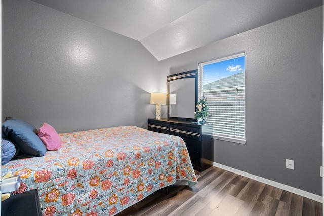 518 Lovers Ln, Dayton, TX 77535 - bedroom featuring lofted ceiling and dark hardwood / wood-style floors