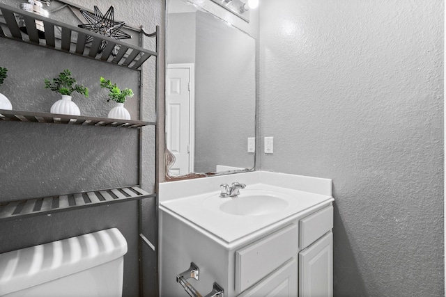 518 Lovers Ln, Dayton, TX 77535 - bathroom featuring vanity and toilet