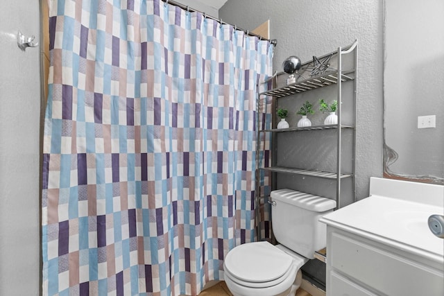 518 Lovers Ln, Dayton, TX 77535 - bathroom featuring vanity and toilet