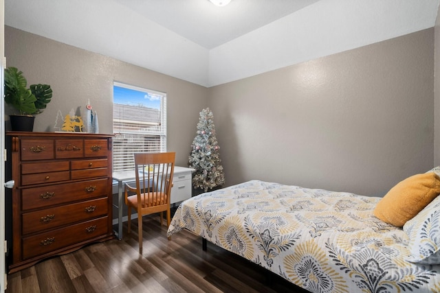 518 Lovers Ln, Dayton, TX 77535 - bedroom with a raised ceiling, vaulted ceiling, and dark wood-type flooring