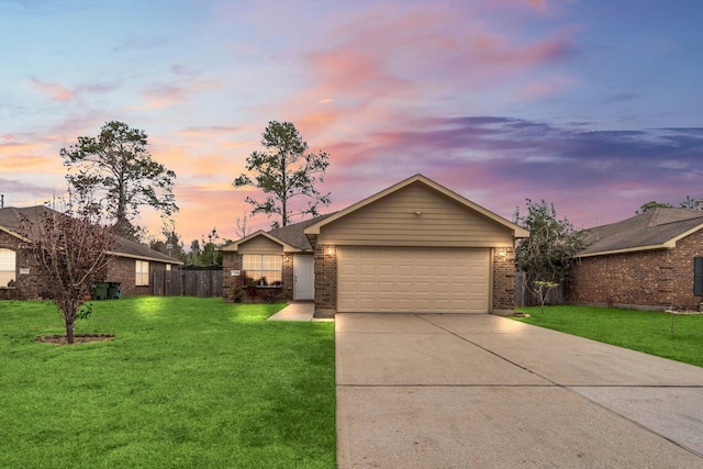 518 Lovers Ln, Dayton, TX 77535 - ranch-style house with a garage and a yard
