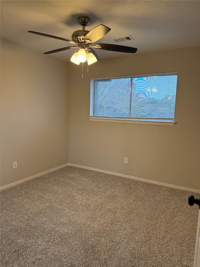 unfurnished room featuring carpet flooring and ceiling fan