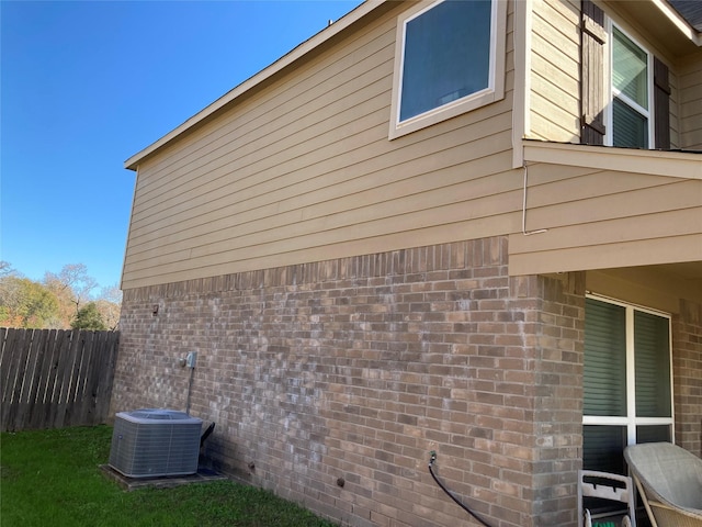 view of home's exterior featuring central AC unit