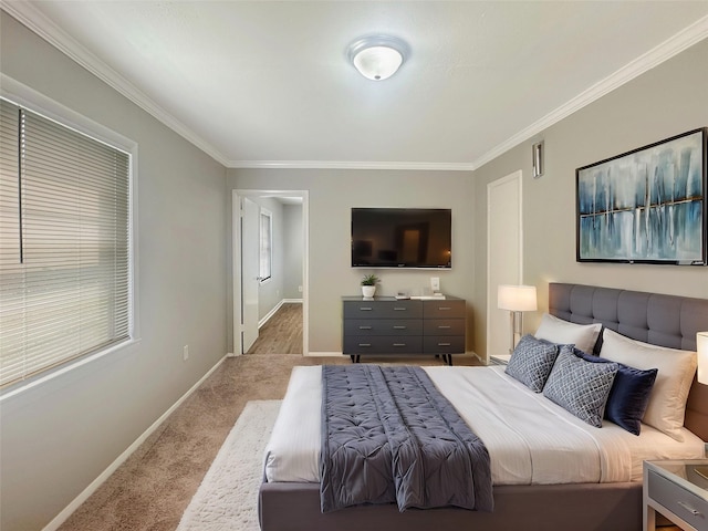 carpeted bedroom featuring ornamental molding and baseboards