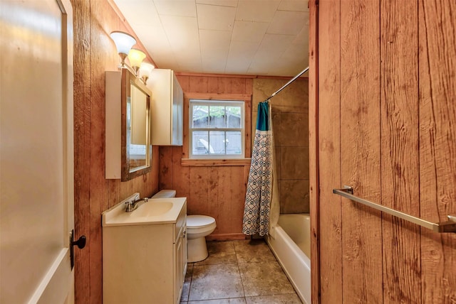 full bathroom featuring vanity, shower / tub combo, wooden walls, and toilet