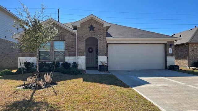 view of front facade with a garage and a front yard