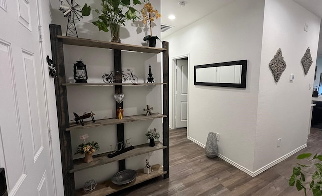 corridor with dark hardwood / wood-style floors