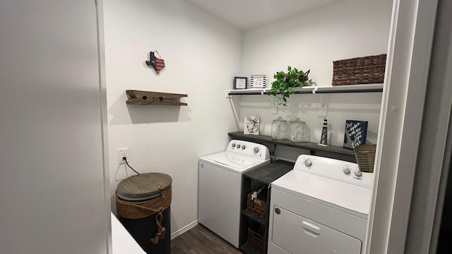 washroom featuring separate washer and dryer and dark hardwood / wood-style flooring