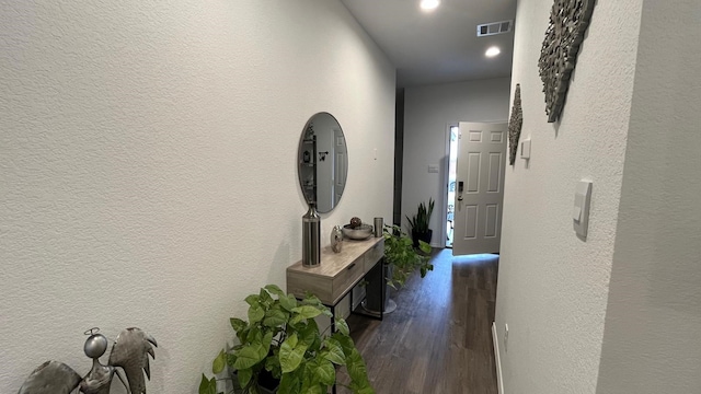 hallway featuring dark wood-type flooring