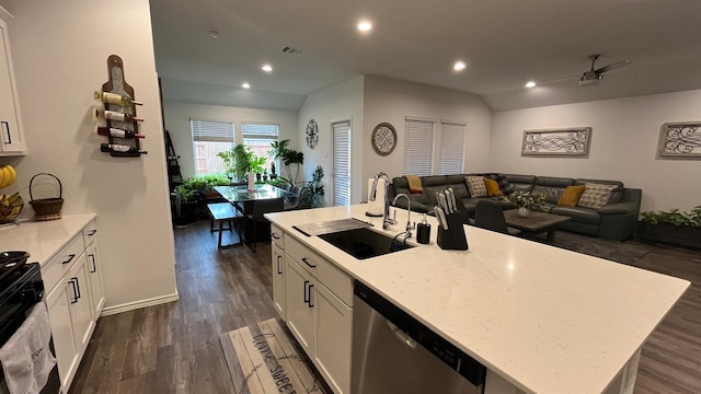 kitchen with dishwasher, sink, white cabinets, dark hardwood / wood-style flooring, and a center island with sink