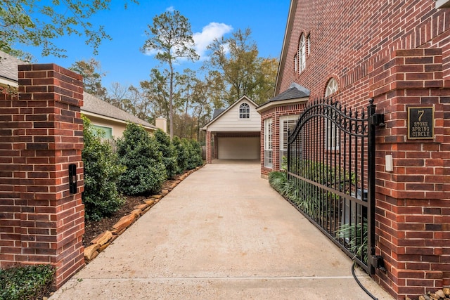 view of gate featuring an outdoor structure