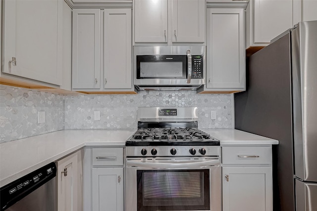 kitchen with white cabinetry and stainless steel appliances