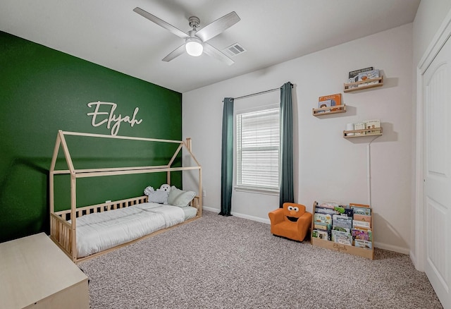 bedroom with ceiling fan and carpet flooring