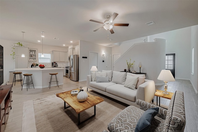 living room with ceiling fan