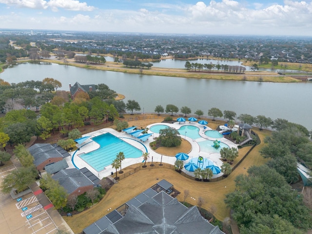 birds eye view of property with a water view