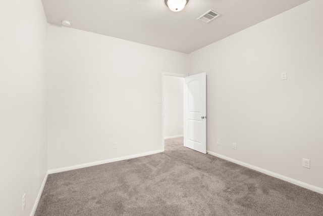 spare room featuring carpet floors