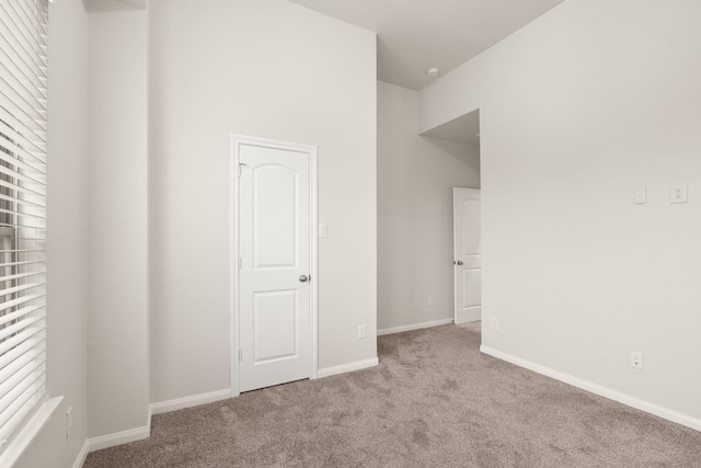 unfurnished bedroom with light carpet