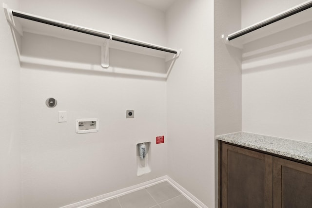 washroom featuring tile patterned flooring, hookup for an electric dryer, hookup for a gas dryer, and hookup for a washing machine