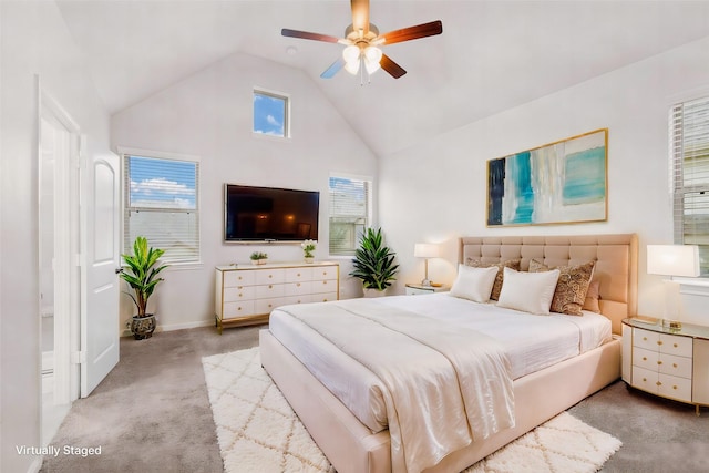 bedroom with ceiling fan, light colored carpet, and high vaulted ceiling