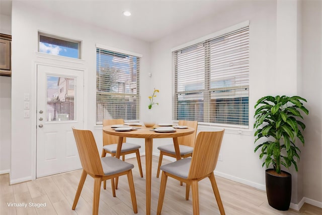 dining room with light wood-type flooring