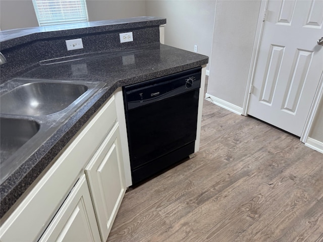 kitchen featuring white cabinets, light hardwood / wood-style floors, sink, and dishwasher