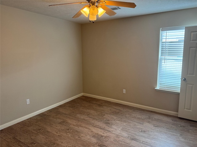 spare room featuring hardwood / wood-style floors, a textured ceiling, and ceiling fan