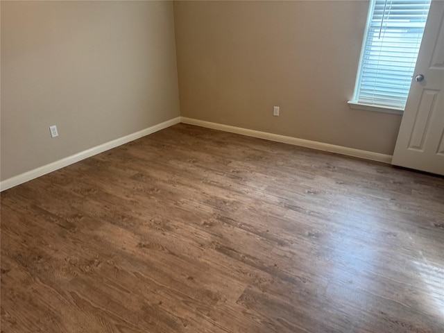 spare room with hardwood / wood-style flooring