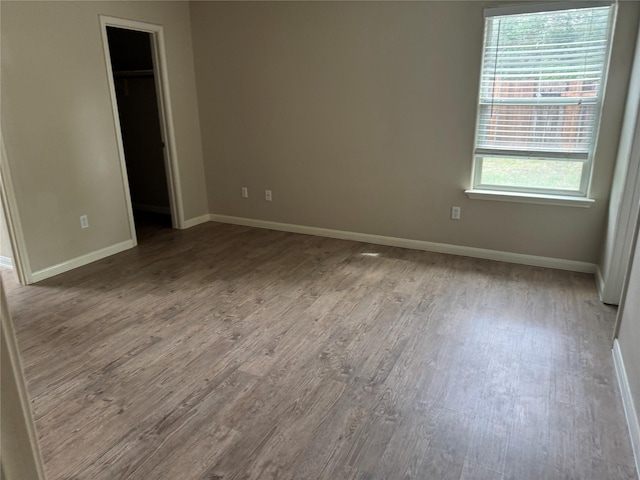 spare room with a healthy amount of sunlight and light hardwood / wood-style flooring