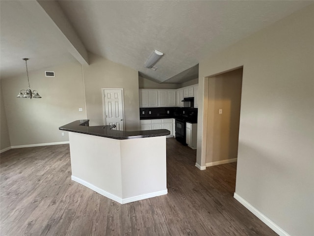 kitchen with hanging light fixtures, white cabinetry, black electric range oven, and dark hardwood / wood-style floors