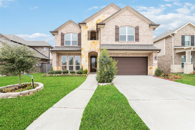 french country inspired facade featuring a garage and a front yard