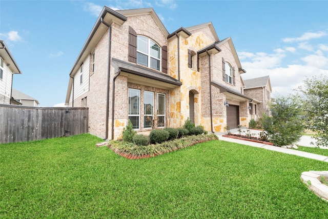 view of front of home featuring a garage and a front lawn