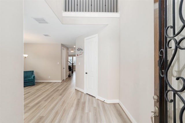 foyer with light hardwood / wood-style flooring