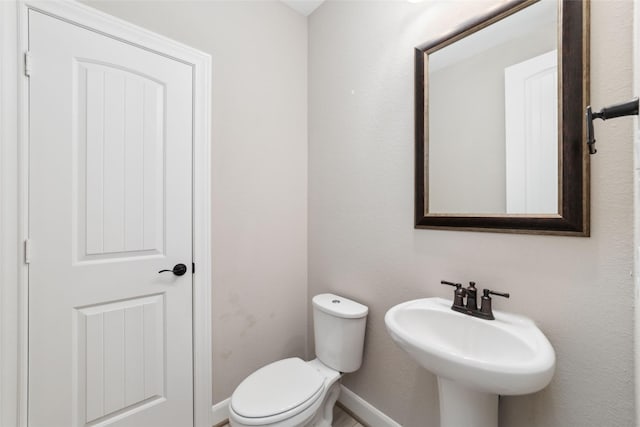 bathroom with sink and toilet