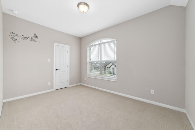 unfurnished room with light colored carpet