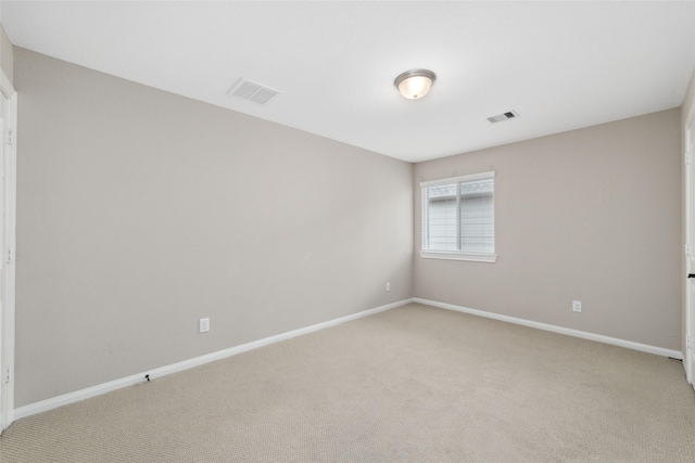 empty room featuring light carpet