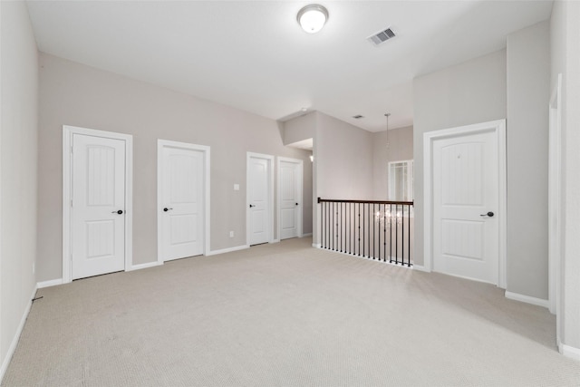 unfurnished bedroom featuring light colored carpet