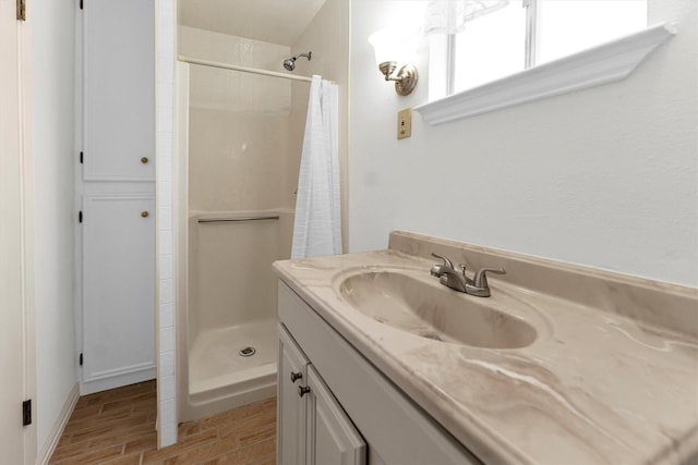 bathroom with vanity and curtained shower