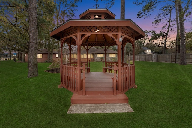 view of home's community featuring a yard, a gazebo, and a wooden deck