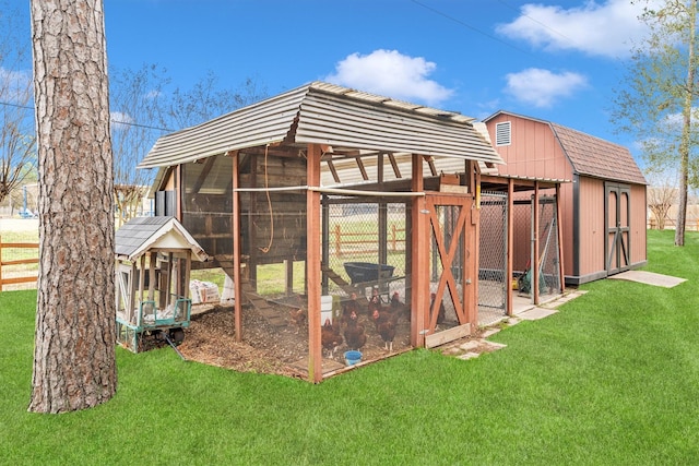 view of outbuilding with a lawn