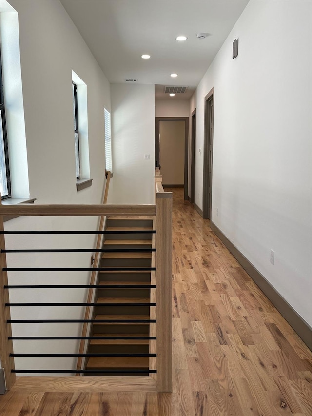 corridor featuring light hardwood / wood-style floors