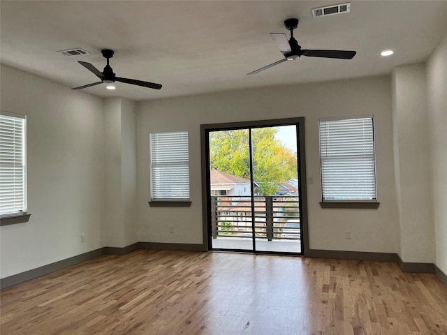 unfurnished room featuring ceiling fan and light hardwood / wood-style flooring