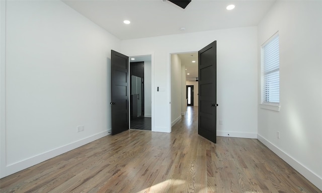 unfurnished bedroom with light hardwood / wood-style floors