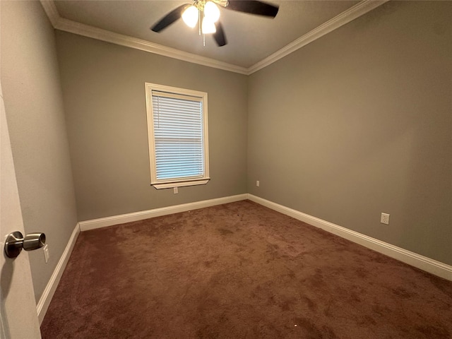 carpeted spare room with ornamental molding and ceiling fan