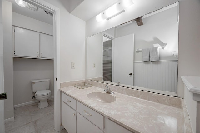 bathroom with vanity and toilet