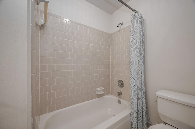 bathroom featuring toilet and shower / bath combo