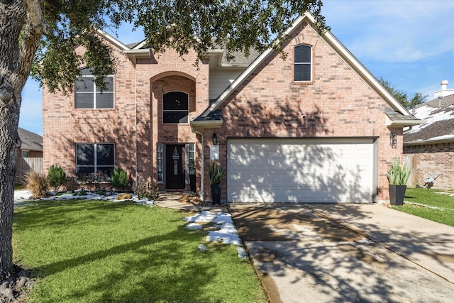 front of property featuring a garage and a front lawn